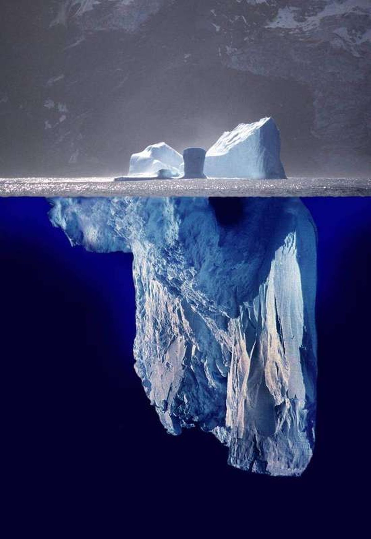 Why does ice float but most solids sink?